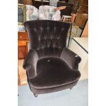 A vintage brown dralon easy chair