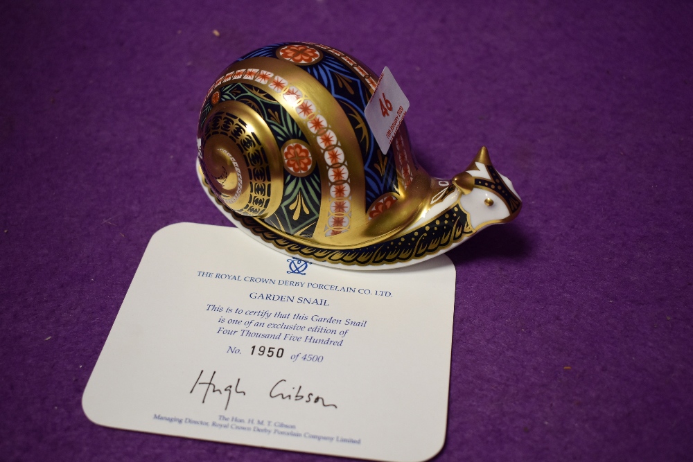 A Royal Crown Derby paperweight Garden Snail with gold stopper and certificate