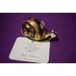 A Royal Crown Derby paperweight Garden Snail with gold stopper and certificate