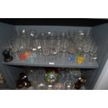 A selection of cocktail wine and party glasses including 50's printed shot glasses