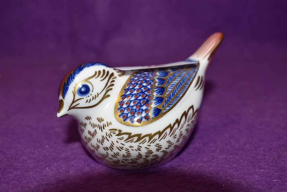 A Royal Crown Derby paperweight Goldcrest with gold stopper