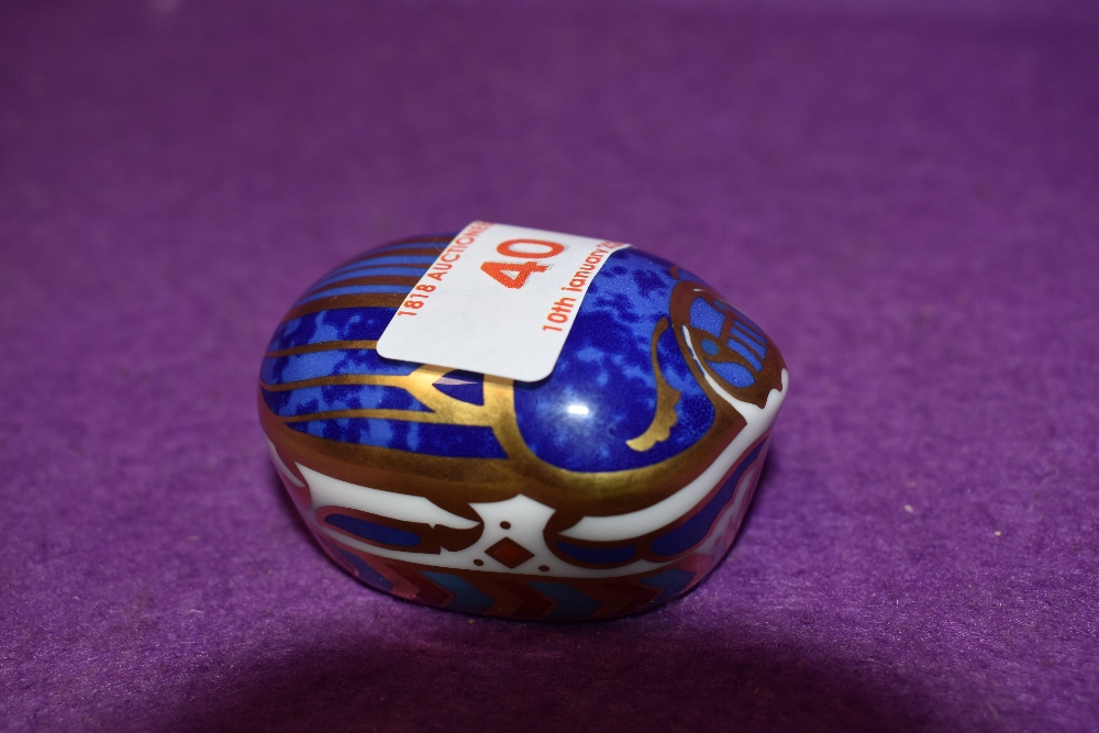 A Royal Crown Derby paperweight Millenium Bug with gold stopper