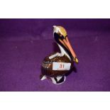 A Royal Crown Derby paperweight Brown Pelican with gold stopper