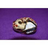 A Royal Crown Derby paperweight Sleeping Dormouse, with silver stopper
