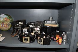 A selection of cameras and photography equipment including Kodak Brownie and Polaroid
