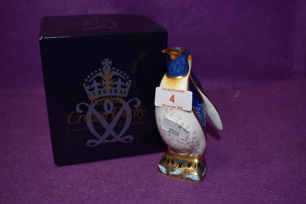 A Royal Crown Derby paperweight Emperor Penguin boxed and with a Gold stopper