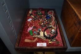 A selection of costume and similar jewellery including broaches and necklace