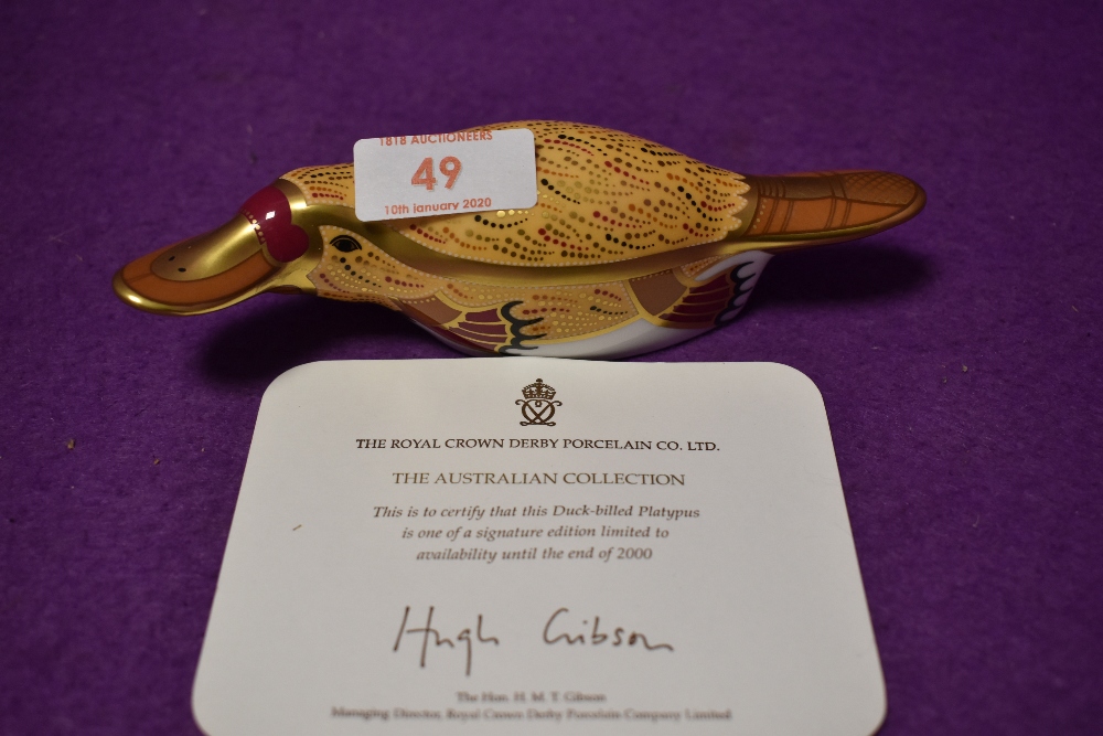 A Royal Crown Derby paperweight Duck Billed Platypus with gold stopper and certificate