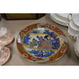 An oriental plate having character mark to back and transfer pattern to front with hand painted