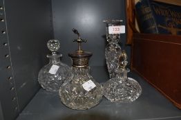 A selection of clear cut and crystal scent or perfume bottles one having Sterling marked atomiser