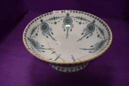 a large antique footed punch bowl by Lyons B and H having stapled repair