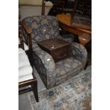 A nice quality early 20th Century low seat armchair having blue foliate upholstery