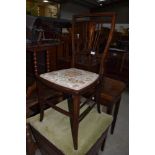 An Edwardian mahogany and inlaid bedroom chair