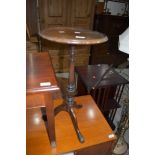 A traditional mahogany wine table on triple splay legs , diameter approx. 31cm
