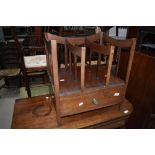 A 19th Century mahogany canterbury having drawer base