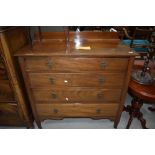 An early 20th Century mahogany bedroom chest of four long drawers having ledge back, width approx.