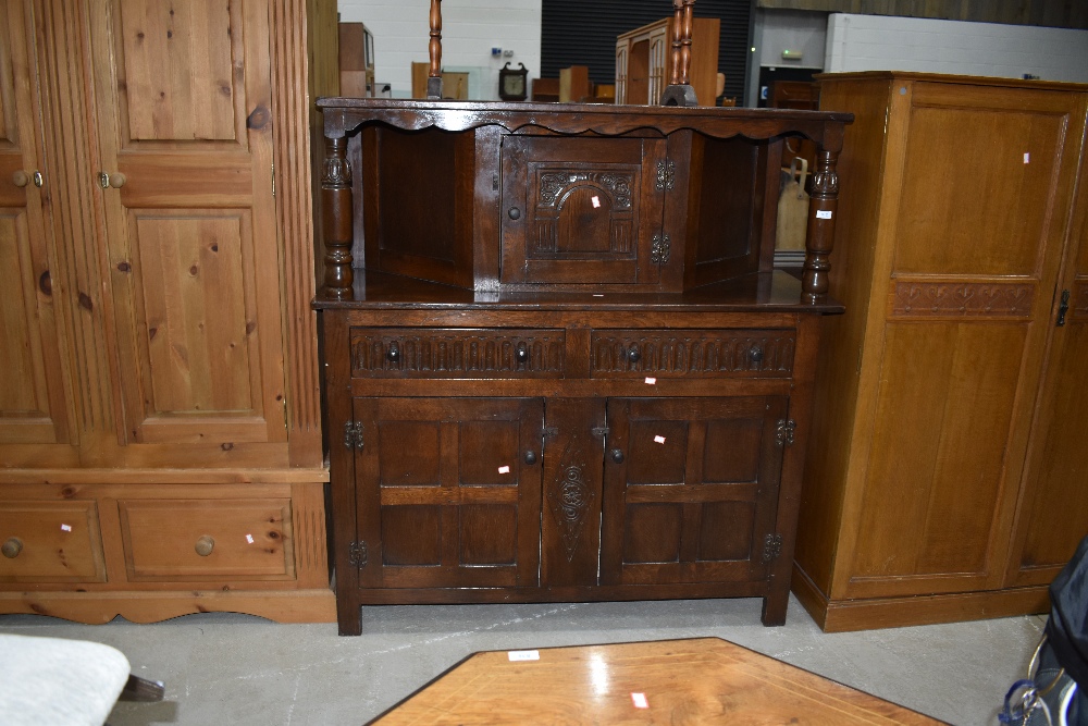 An early to mid 20th Century reproduction oak court cupboard, width approx. 125cm