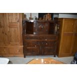 An early to mid 20th Century reproduction oak court cupboard, width approx. 125cm
