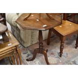 A traditional stained frame octagonal occasional table of triple splay legs, width approx. 51cm