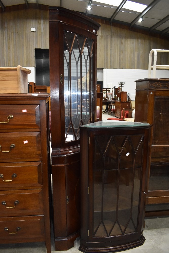 A reproduction corner wall display and a similar with cupboard under