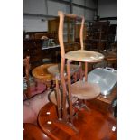 An Edwardian mahogany and inlaid four tier (of interesting side by side offset design) cake