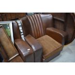 An Art Deco brown three piece suite