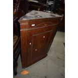 A 19th Century oak corner cupboard