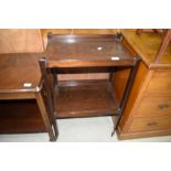 An early 20th Century dark stained oak tea trolley