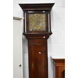 An oak long case clock, having brass dial with 30 hour movement, named Lomas , Poolton, with figural
