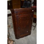 A period oak corner wall cabinet