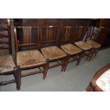 A set of five 19th Century rail back rush seated dining chairs