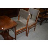 Two vintage upholstered dining chairs