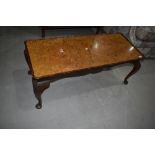 An early to mid 20th Century walnut coffee table having cabriole legs, approx. 107 x 46cm