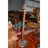 A 19th Century torchere having twist column and carved base, approx. height 92cm