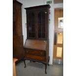 An early 20th Century mahogany bureau bookcase, some worm to top and base