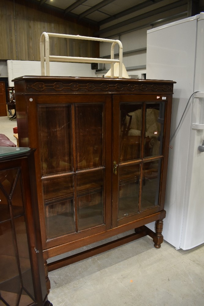 An early 20th Century oak display cabinet on stile frame, width approx. 102cm