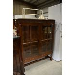 An early 20th Century oak display cabinet on stile frame, width approx. 102cm