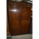 An early 20th Century oak wardrobe, width approx. 101cm