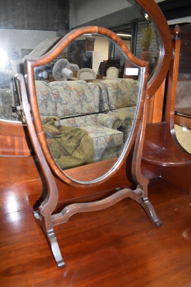 A traditional mahogany dressing table mirror, shield form, width approx. 37cm