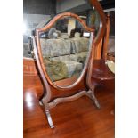 A traditional mahogany dressing table mirror, shield form, width approx. 37cm