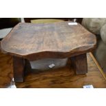 A rustic low footstool, stamped Wanderwood