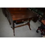 A reproduction Regency side/sofa table having drop flaps, closed with approx. 84cm, depth 51cm