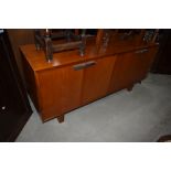 A vintage sapele or teak office sideboard having chromed handles, labelled for Port Eglinton, Andrew