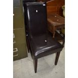 A pair of leatherette dining chairs