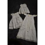 Two early 20th century childrens dresses with beautiful cut work and embroidered techniques used,