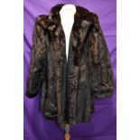 A mid length vintage dark brown mink coat having Continental furs,Blackpool label.