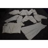A collection of victorian white cotton items including two pairs of Victorian bloomers, crisp cotton