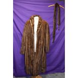 A vintage brown mink coat and tippet with feet and tales.