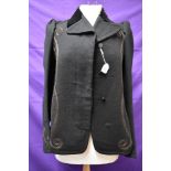 An early 20th century black wool jacket with cord detailing to front and cuffs,velvet collar,