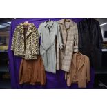 A collection of vintage ladies coats and jackets,various styles,fabrics and eras.